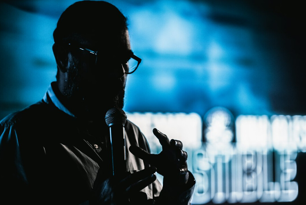 speaker on stage with microphone